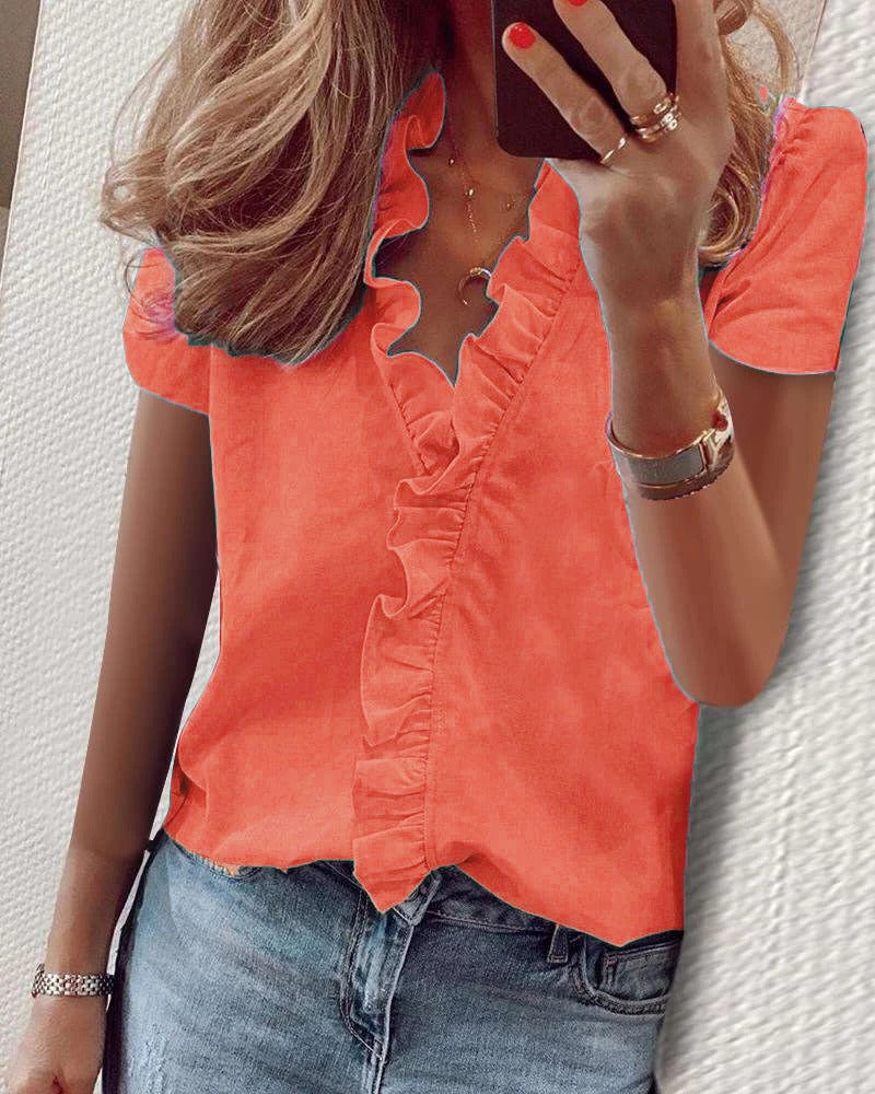 New European and American short sleeved ruffled shirt for woman.